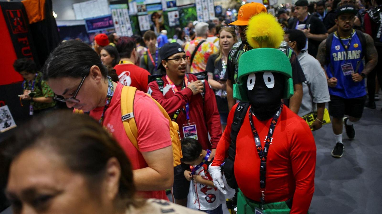 person in a Marvin the Martian costume in a queue