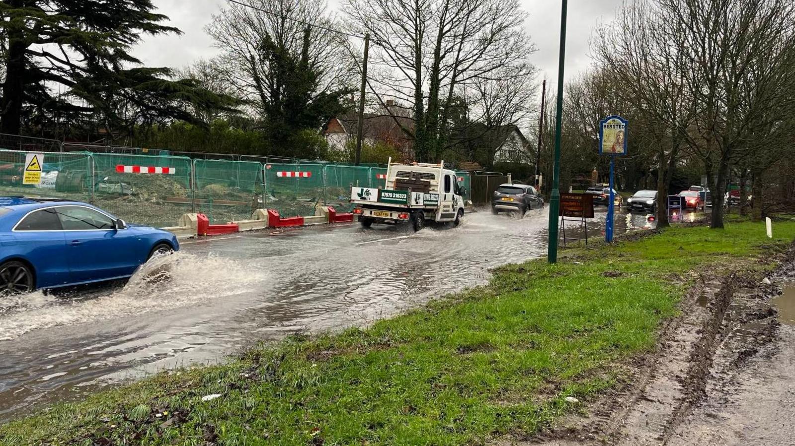 Flooding on the A29 Shripney Road in Bognor Regis, West Sussex. Cars, and one lorry, can be seen travelling through extensive rainwater in both directions