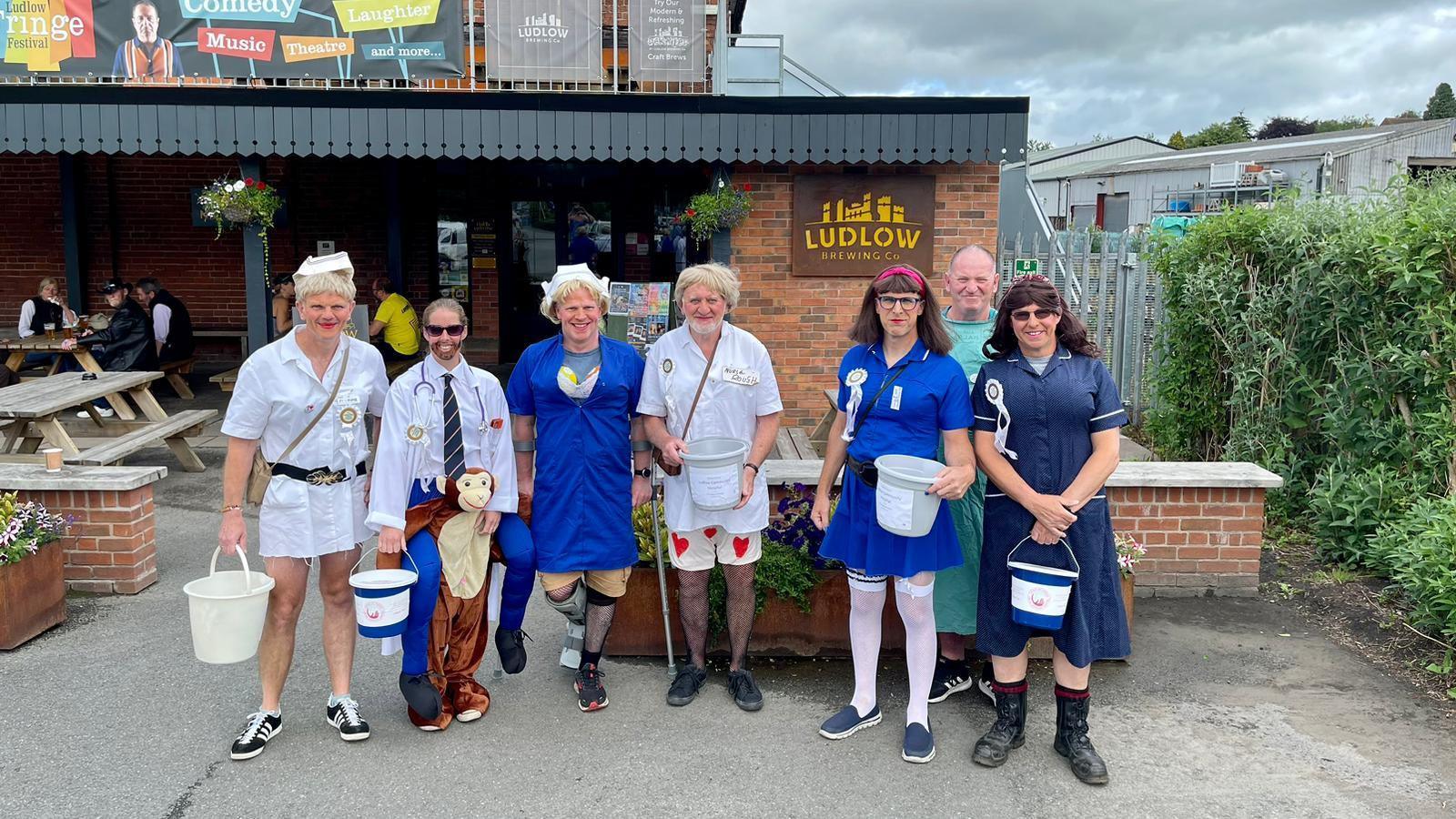 Men dressed in nurse costumes 