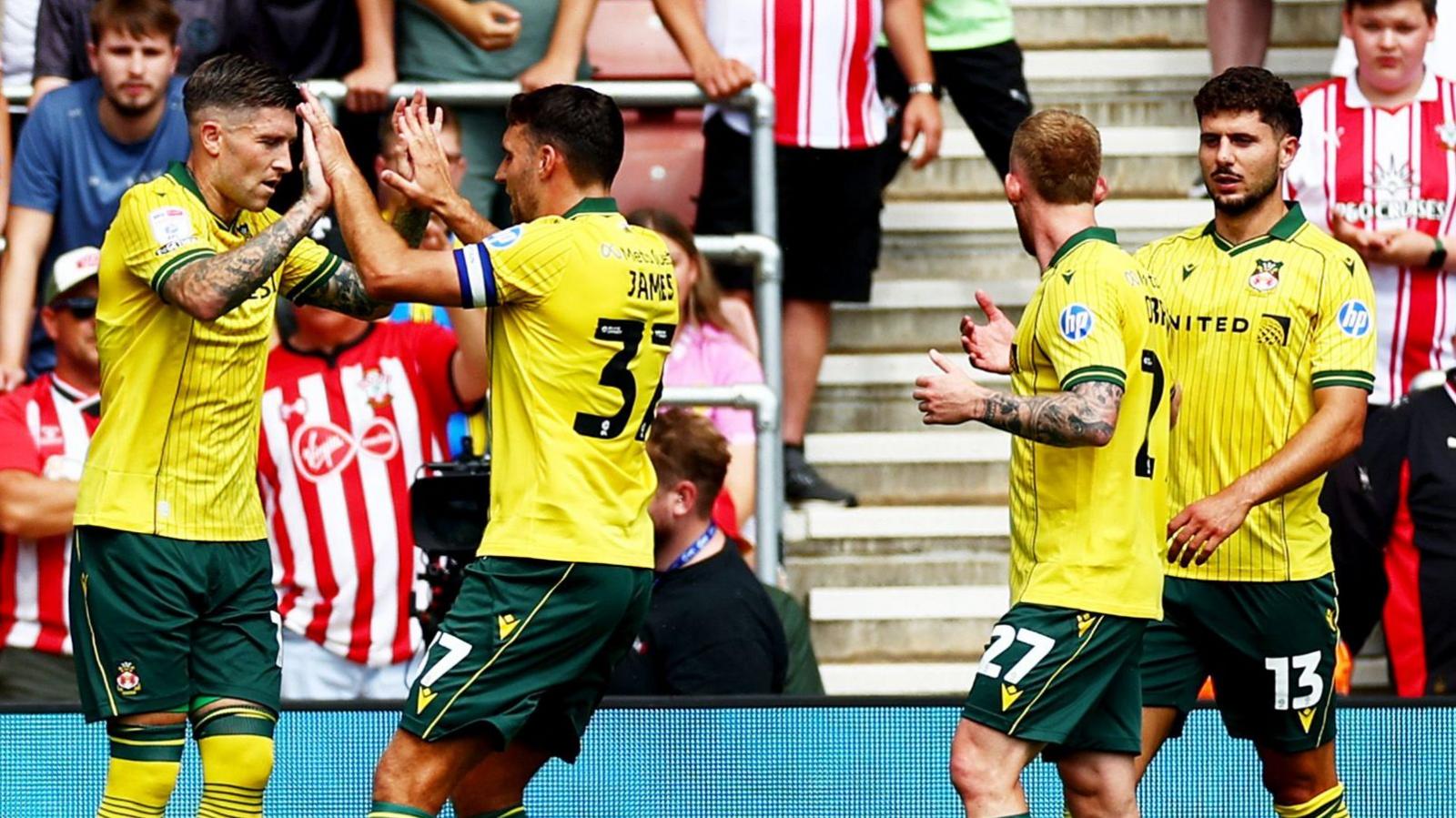 Josh Windass (left) celebrate with Wrexham team-mate Matty James