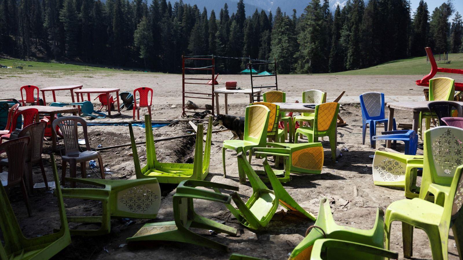 Chairs and tables are scattered at the site of a suspected militant attack on tourists in Baisaran near Pahalgam in south Kashmir's Anantnag district, April 24, 2025.