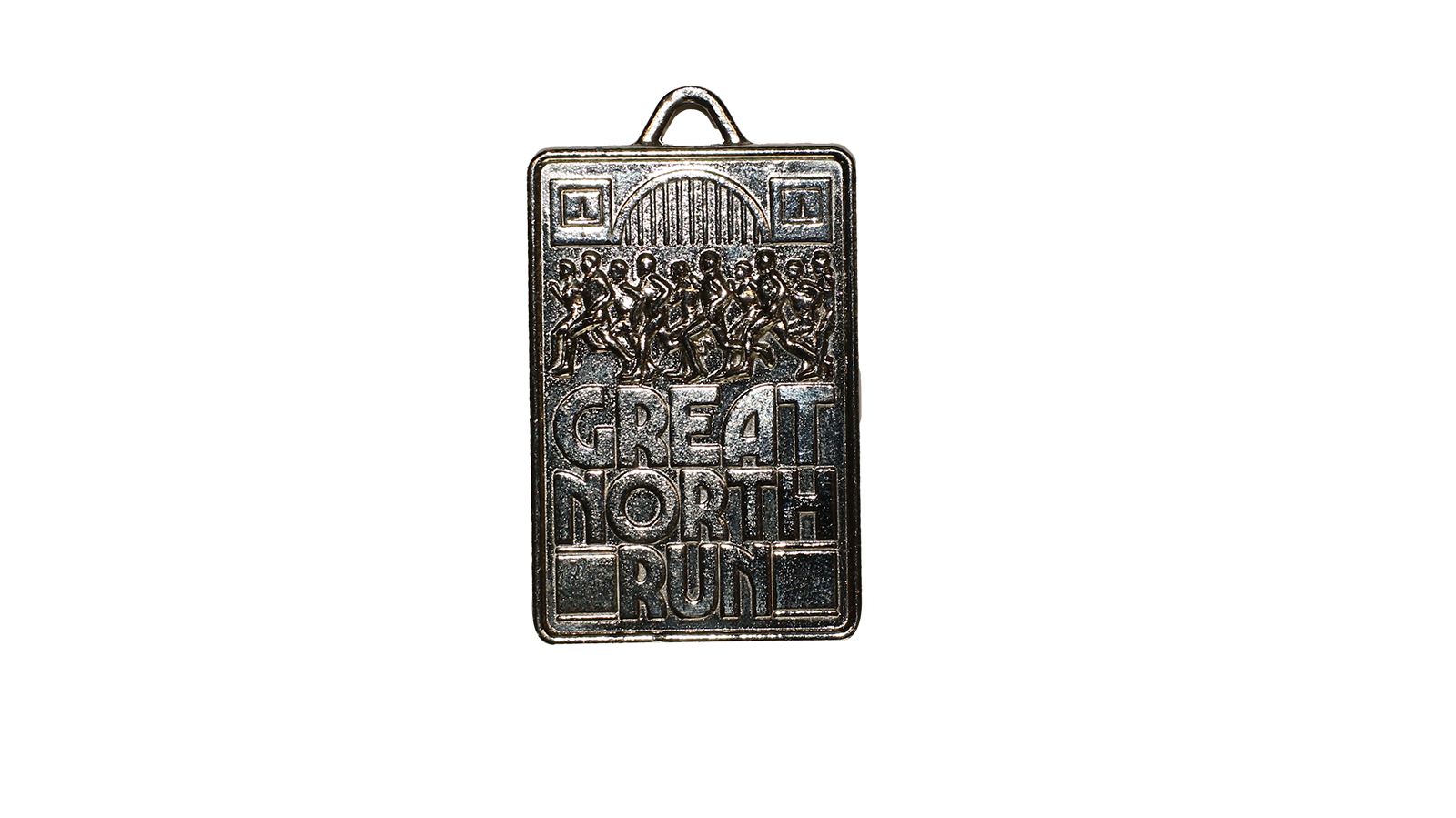 A silver rectangular shaped medal that has 'Great North Run' on with people running at the top and a bridge.