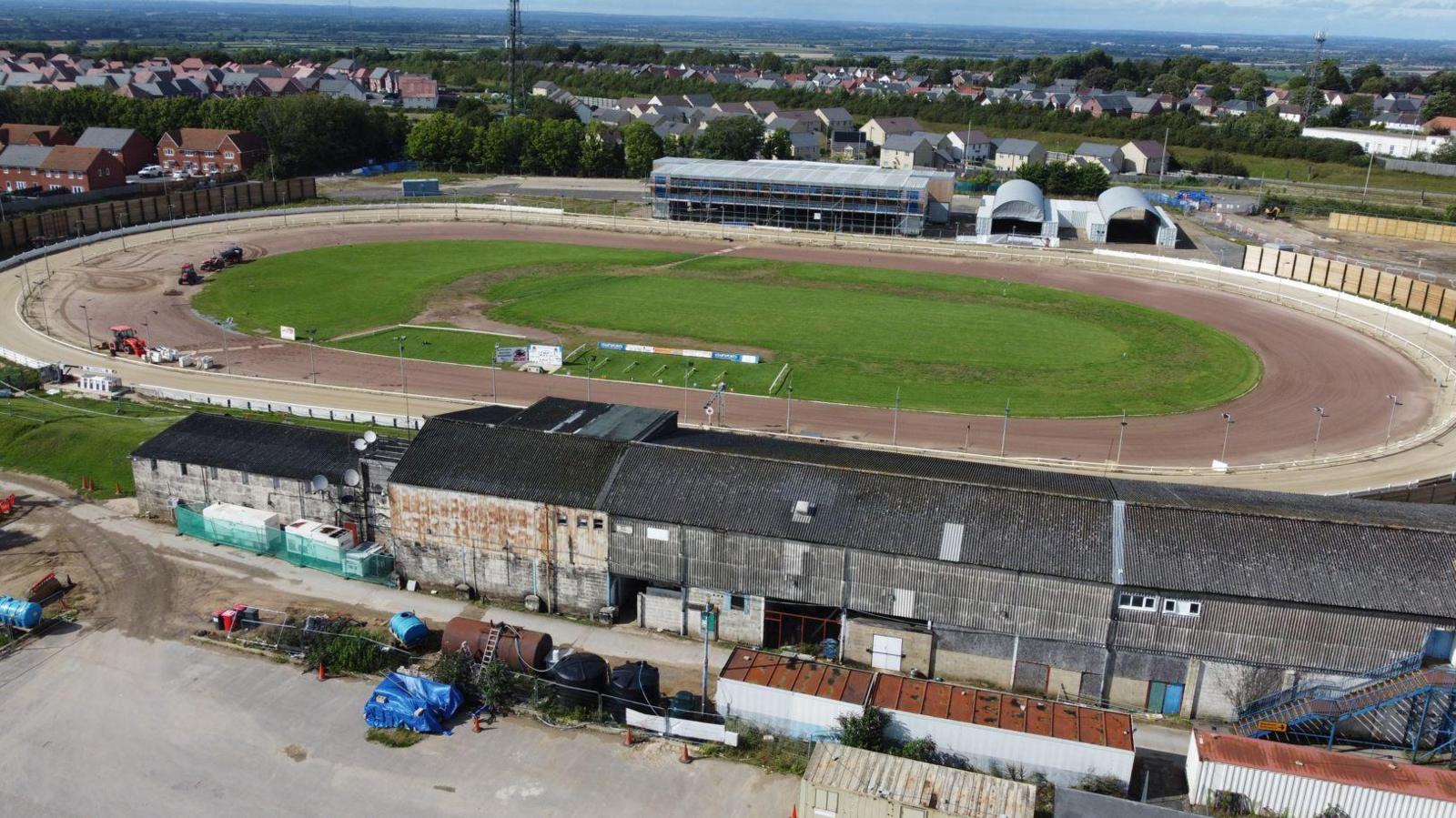 Progress at Abbey Stadium in Swindon. The circular track can be seen, as well as construction machines and vehicles. 