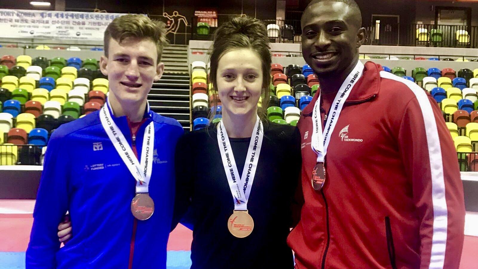 Lauren Williams, Bradly Sinden and Mahama Cho pose with their medals at the World Taekwondo Grand Prix