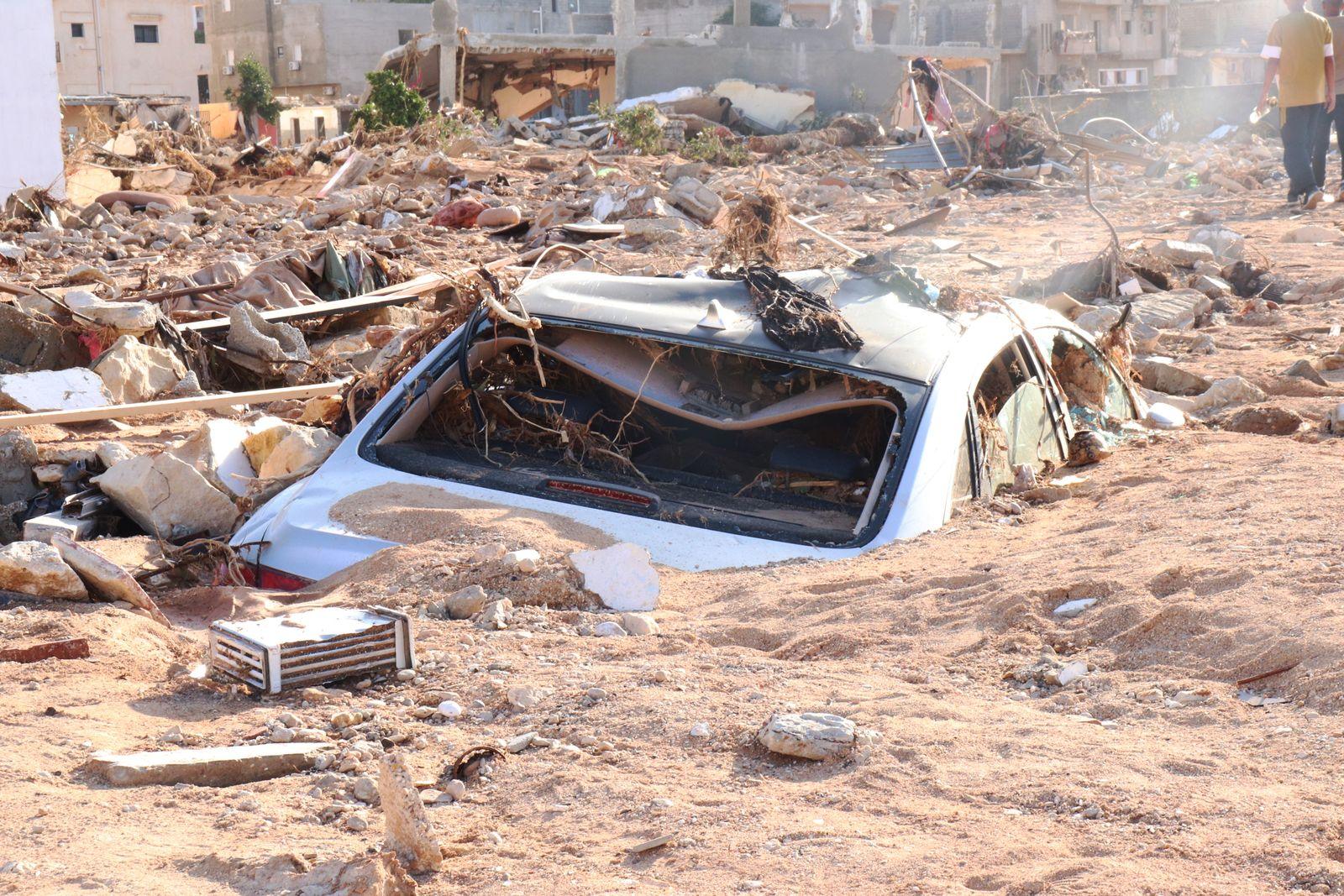 Car engulfed in mud and rubble