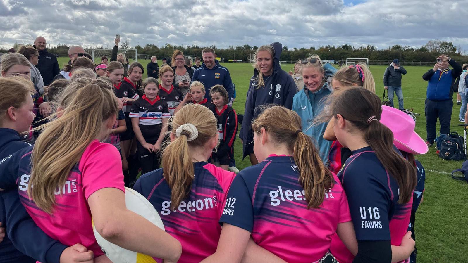 Red Roses players Alex Matthews and Zoe Aldcroft meeting young rugby players at Melksham Rugby Club.