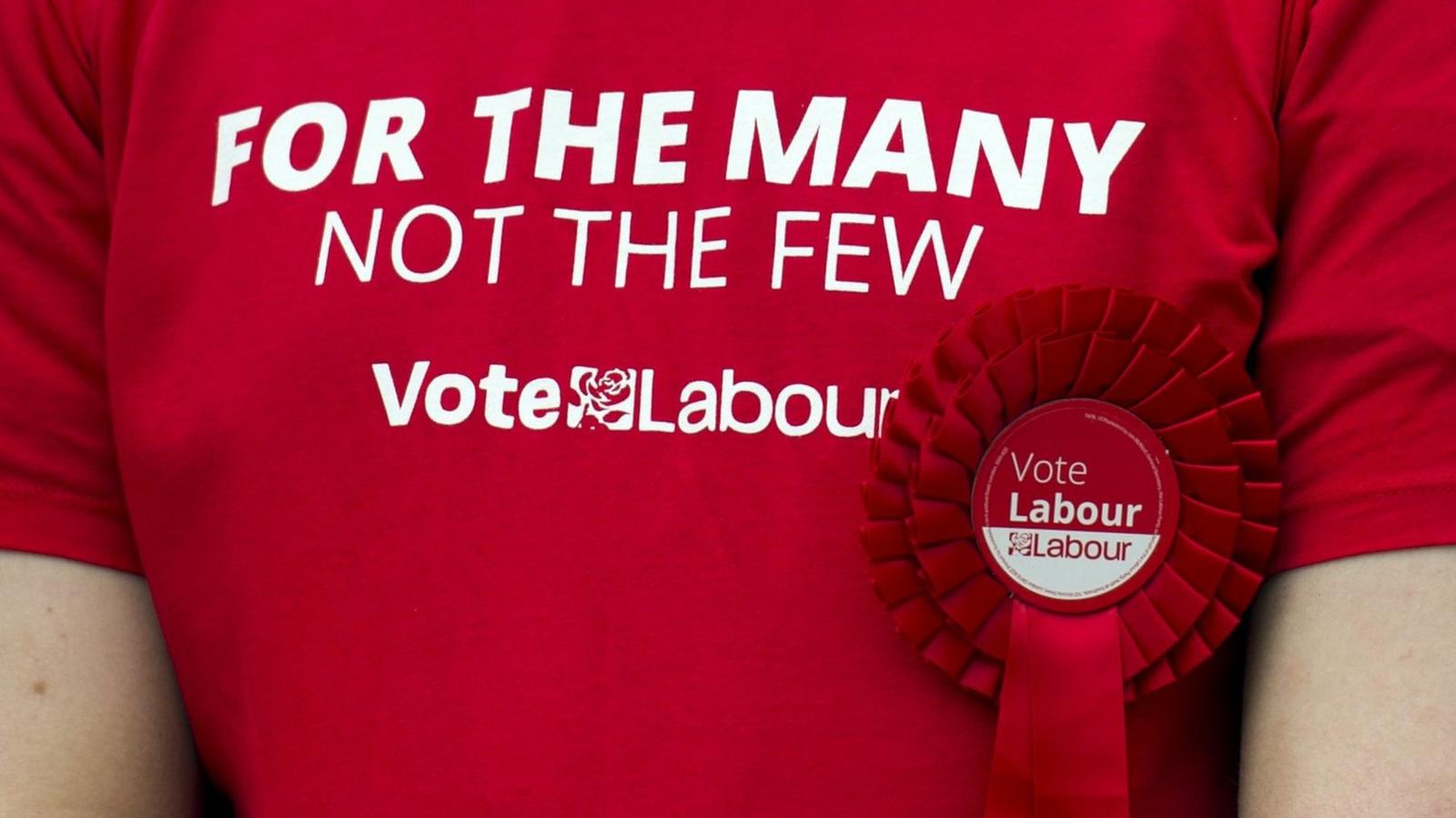 A t-shirt with the Labour logo and the phrase "For the many not the few"