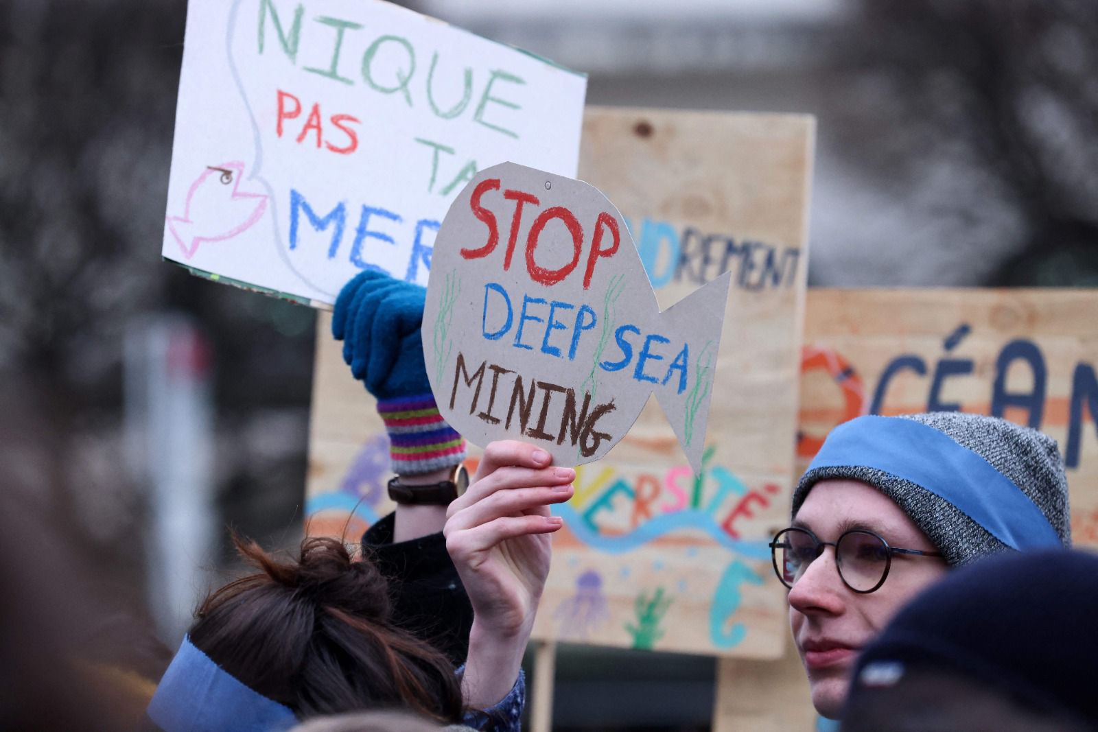 Activists take part at a "Look Down action" rally to stop deep sea mining