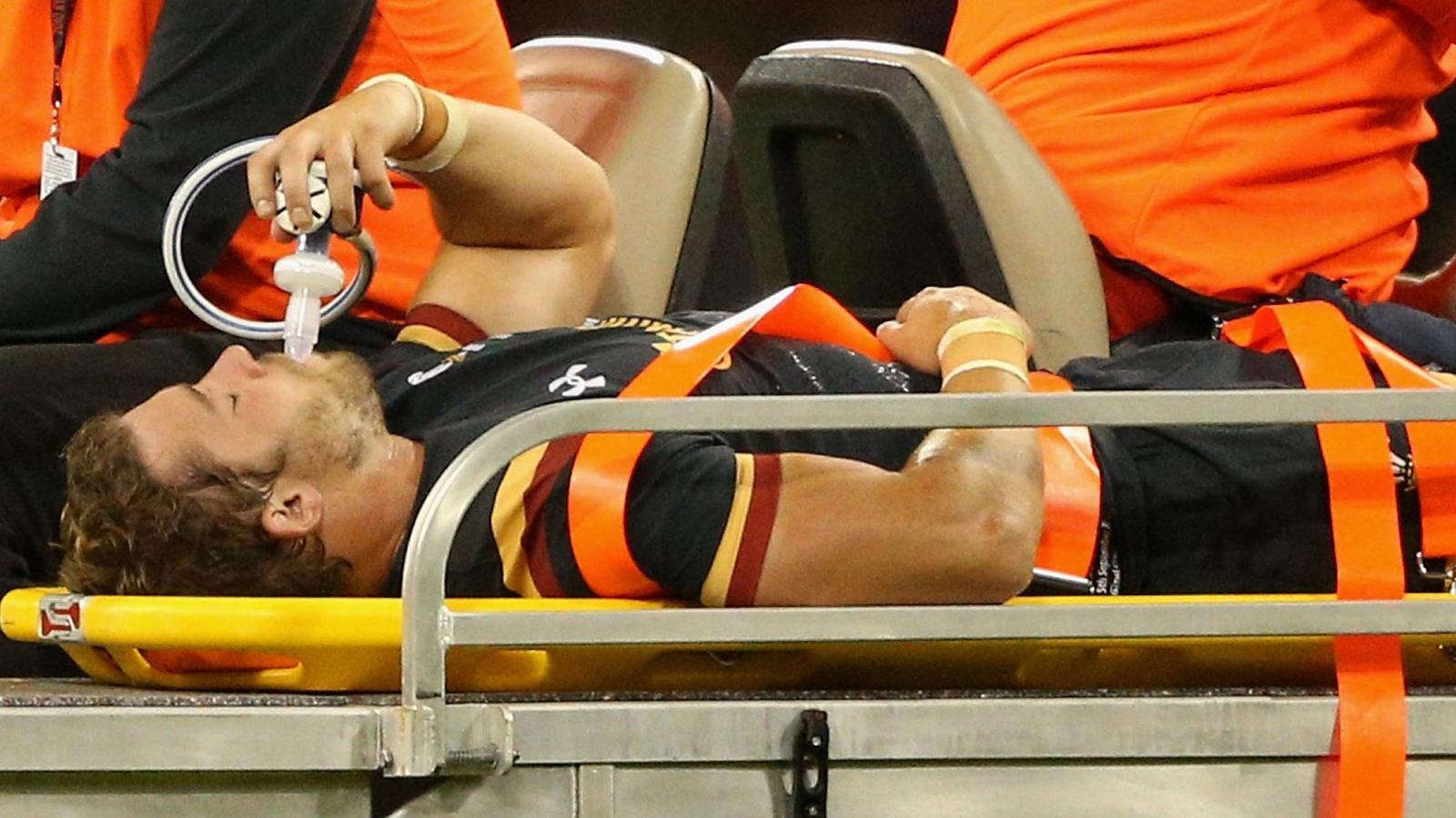 Leigh Halfpenny is taken off the field in pain