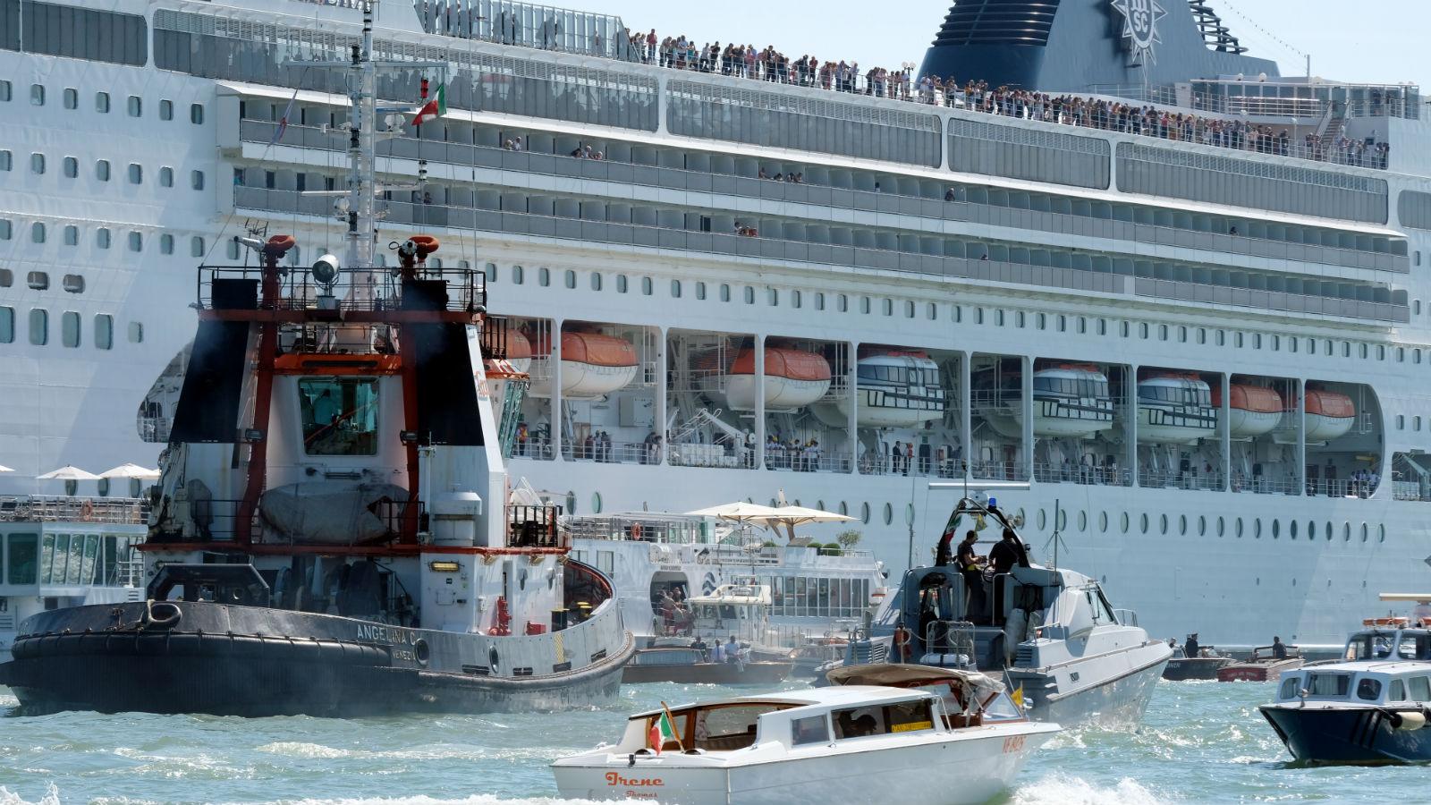 The cruise ship MSC Opera loses control and crashes against a smaller tourist boat at the San Basilio dock in Venice