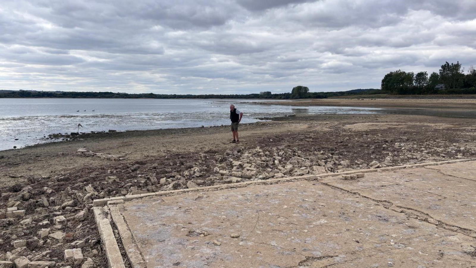 The old foundations of a former Bungalow on the edge of Rutland Water, which is usually submerged but has been revealed by lower water levels.