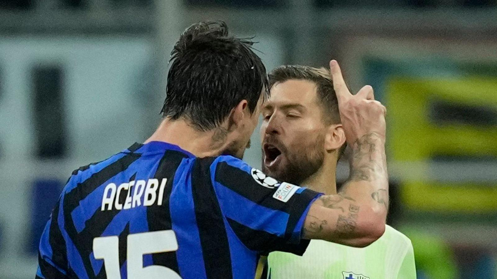 Inter Milan's Francesco Acerbi confronts Barcelona's Inigo Martinez
