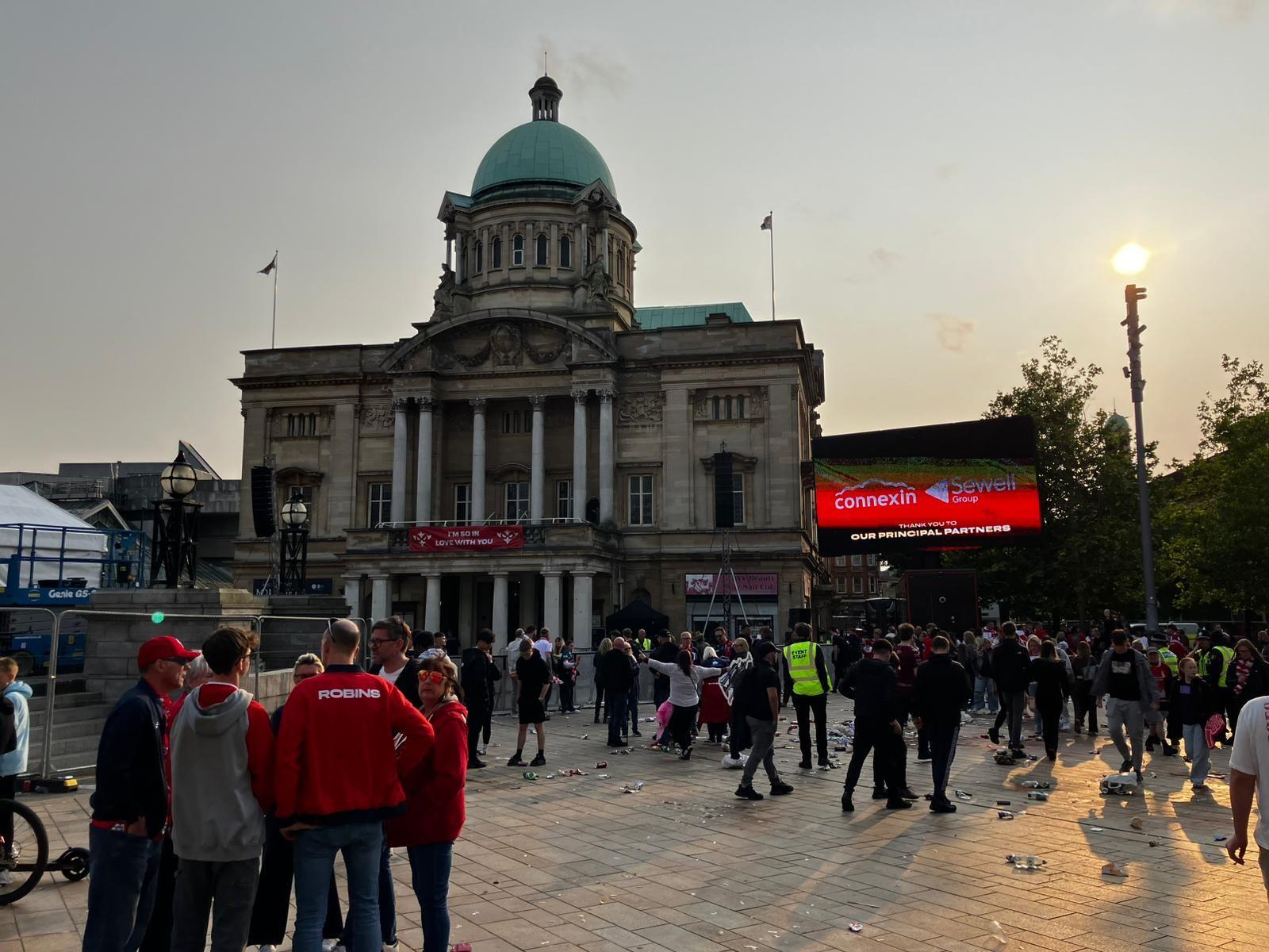 Crowds make their way from Queen Victoria Square in Hull. Litter has been left strewn across the ground.
