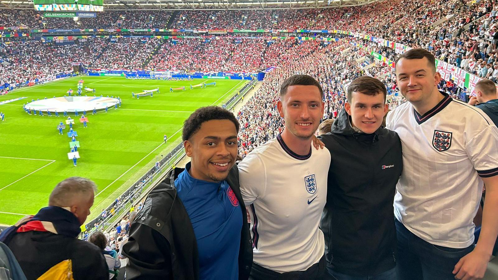 (L-R) Noah Byron, Tom Noonan, Samuel Adams, Tom Free at the football game in Germany