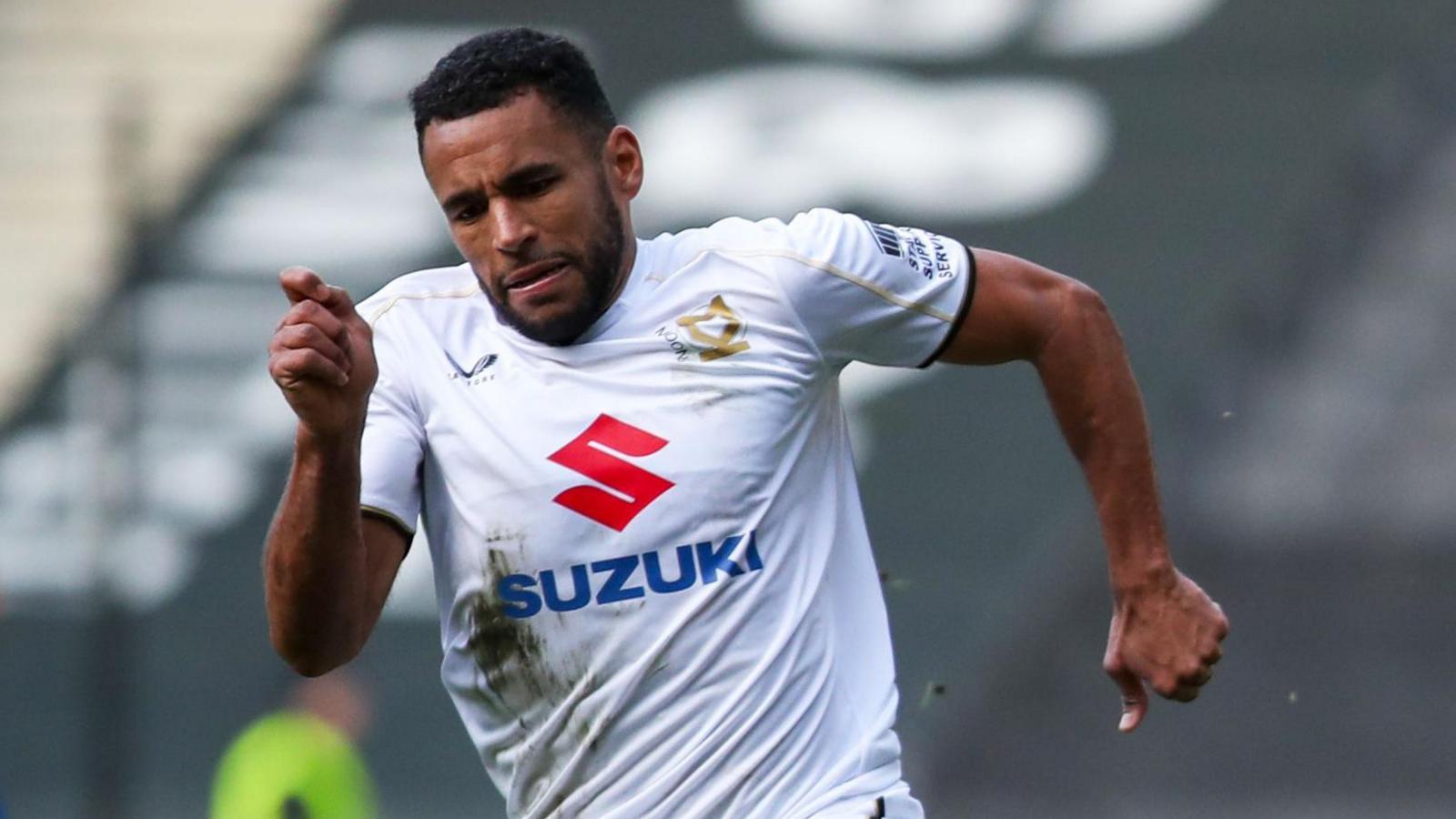 Nathan Thompson playing for MK Dons against AFC Wimbledon