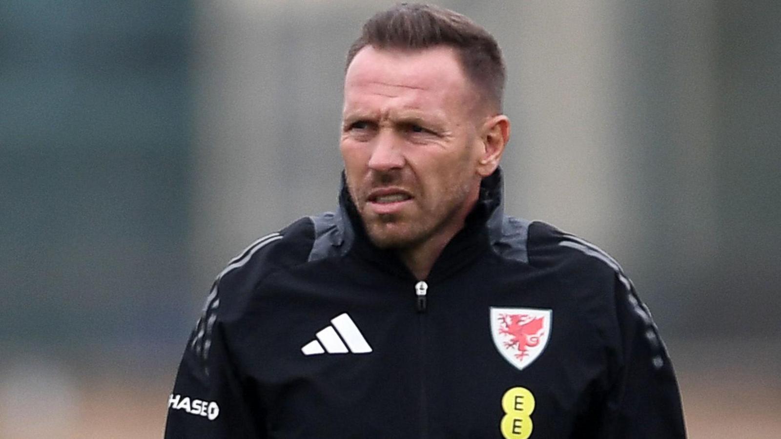 Craig Bellamy watches Wales train