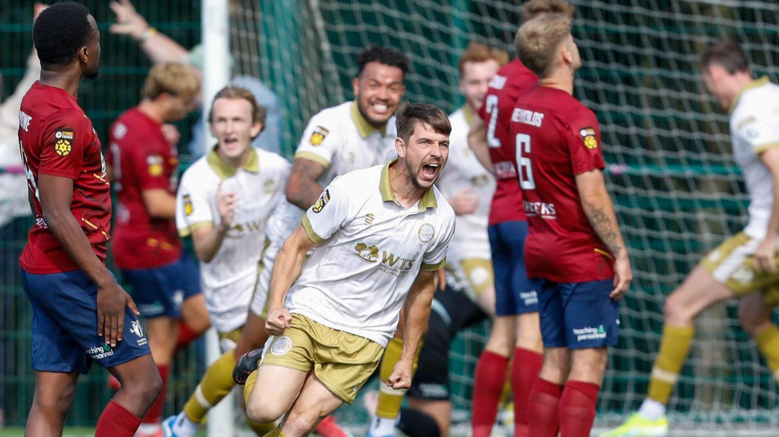 Darren Thomas celebrates after scoring Caernarfon's late leveller at Cardiff Met