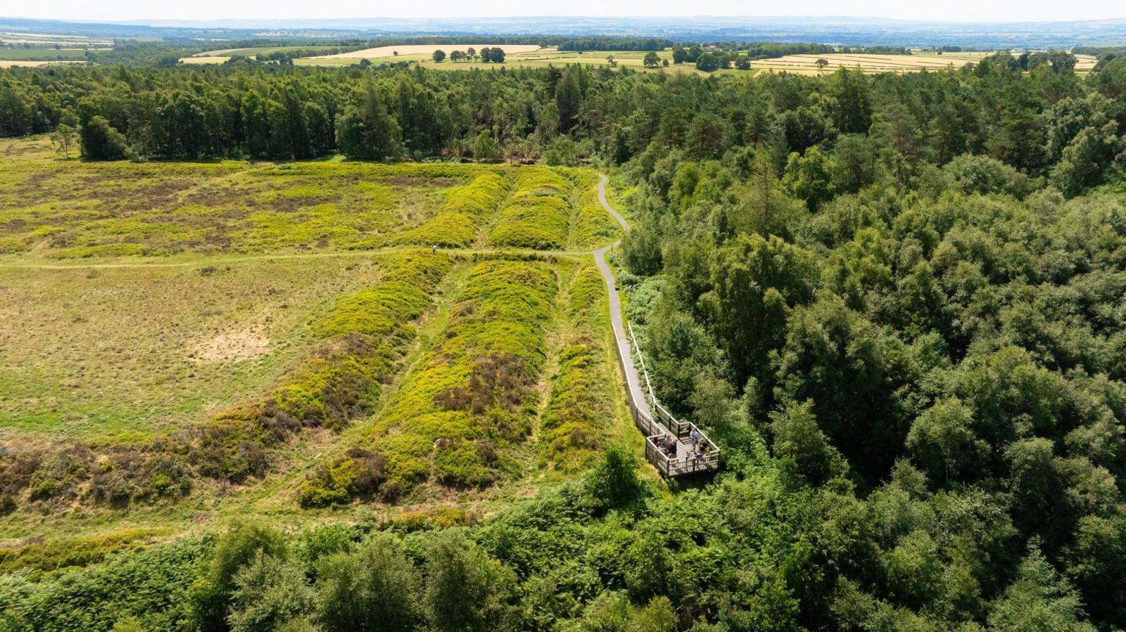 An aerial view of earthworks and a trail in the North York Moors.