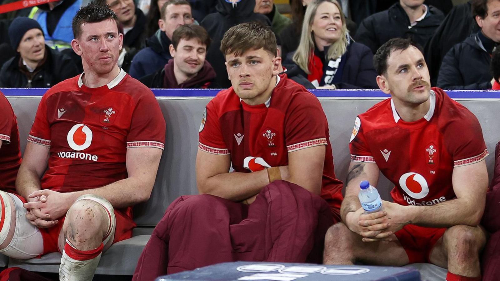 Wales players Adam Beard, Alex Mann and Tomos Williams look dejected after losing to England at Twickenham