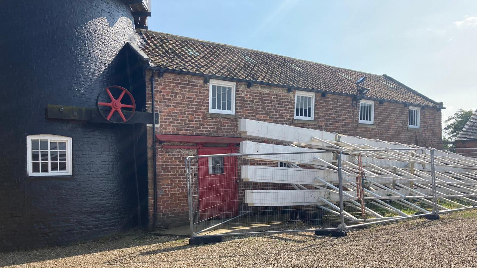 Four new sails stacked next to Skidby Mill