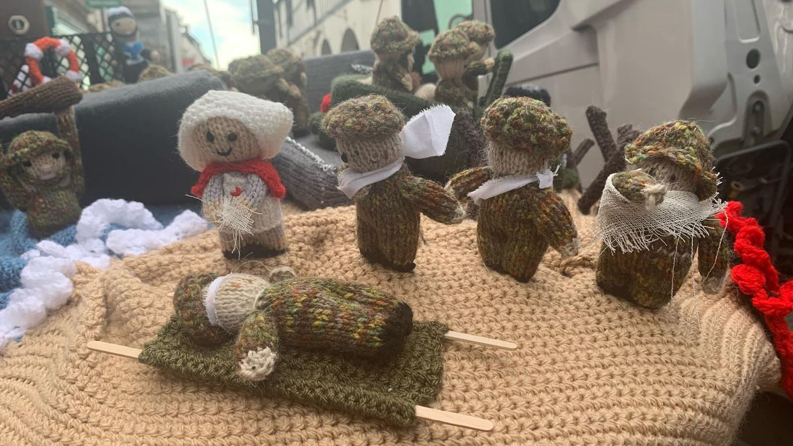 Knitted scenes from D-Day on top of a postbox