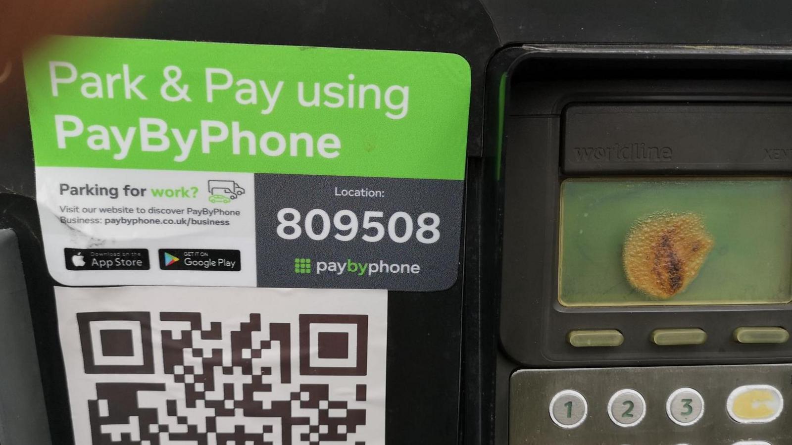 A parking payment machine with the fake QR code on its front