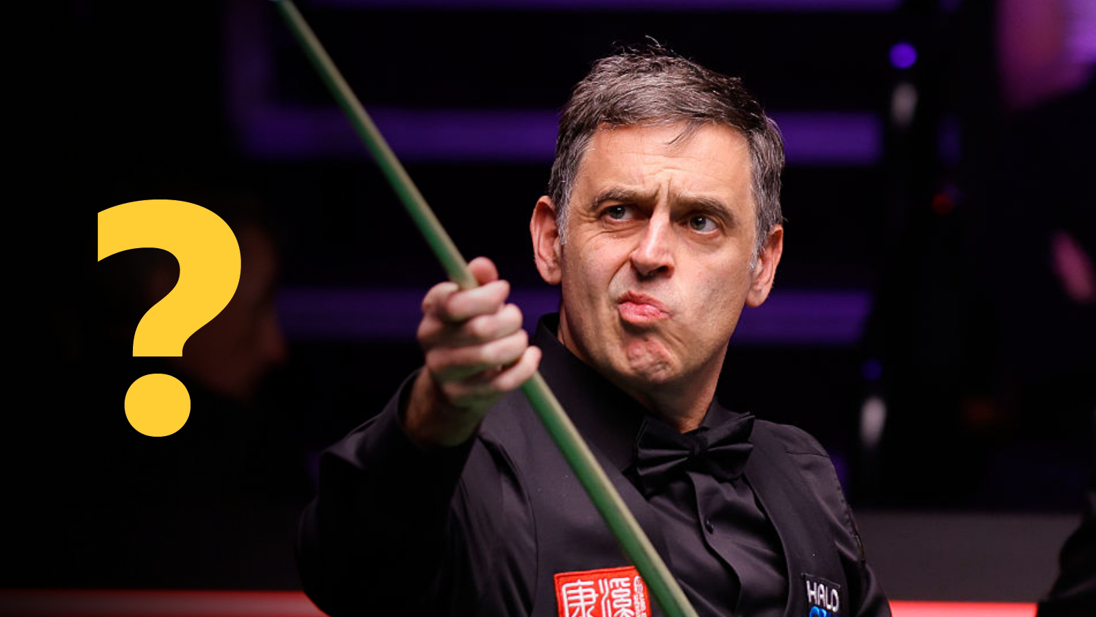 Ronnie O'Sullivan looking at his cue after playing a shot