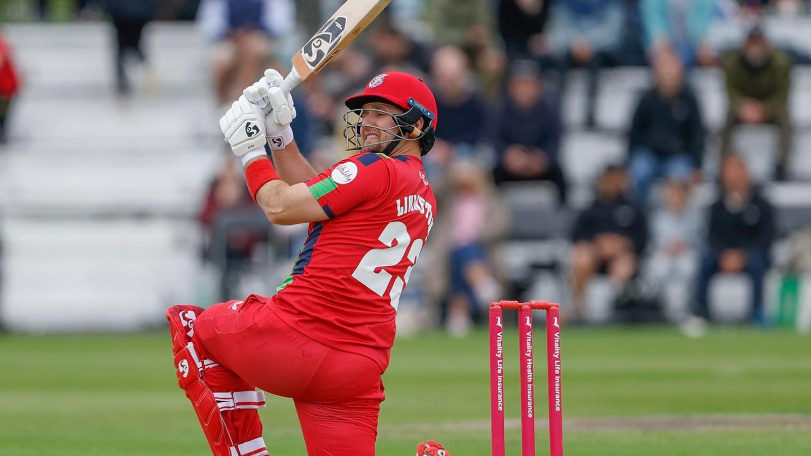 Liam Livingstone, on one knee, hits another boundary for Lancashire against Glamorgan on Sunday.