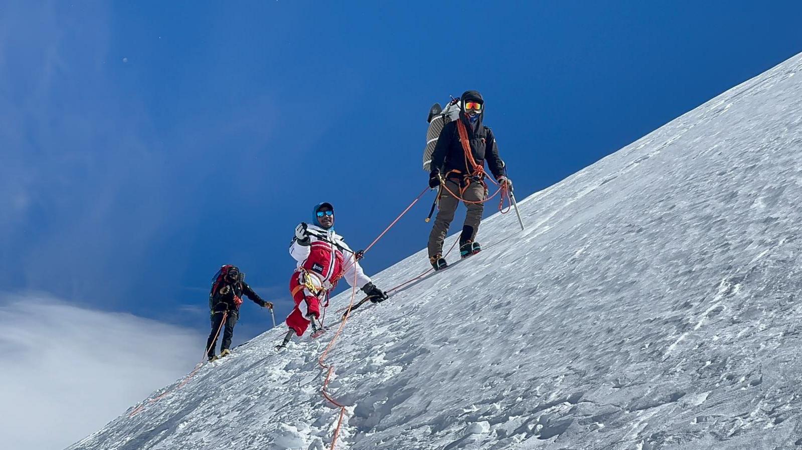 Hari Budha Magar climbing Denali with support team