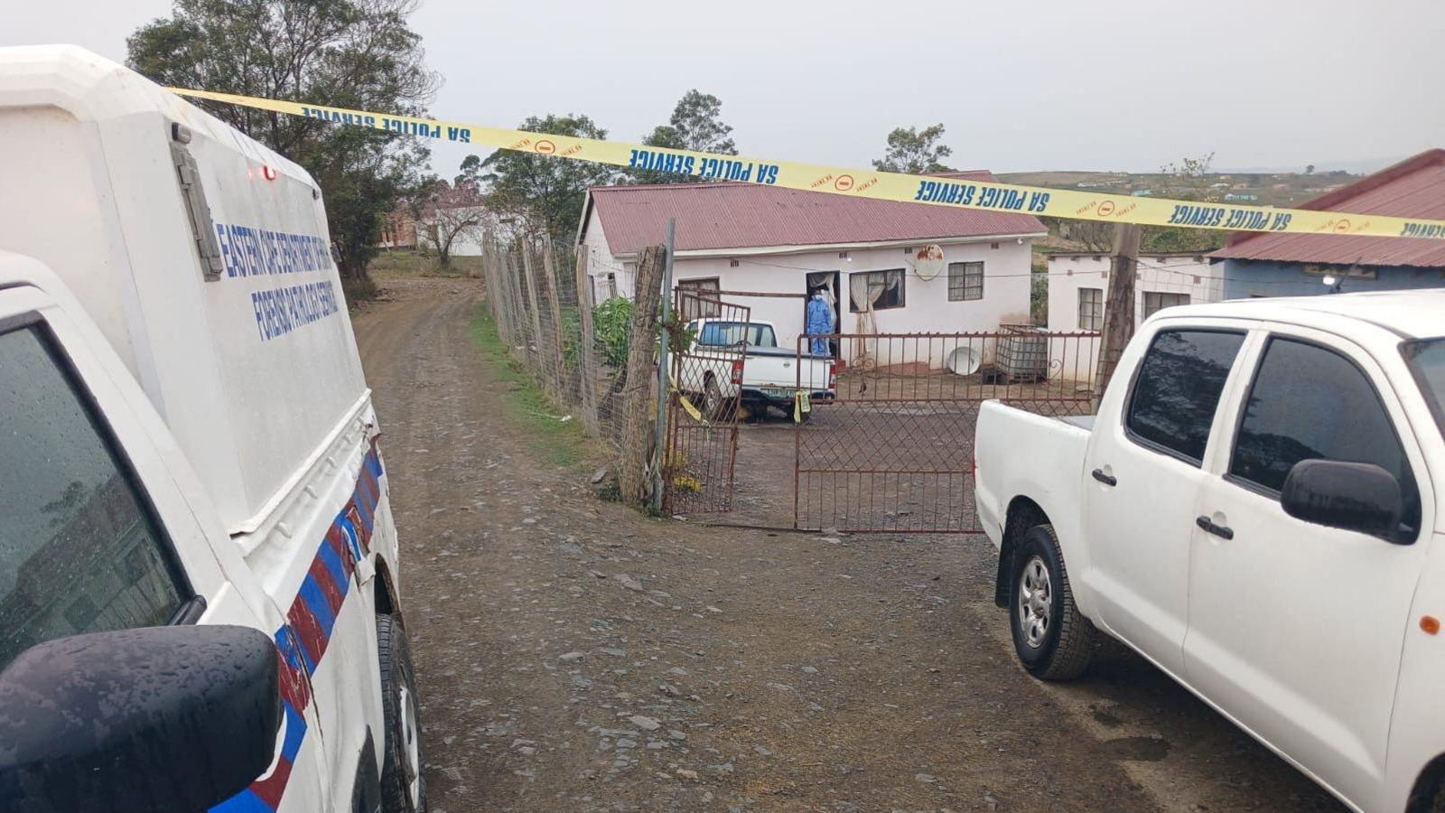 An image of police vans outside the crime scene