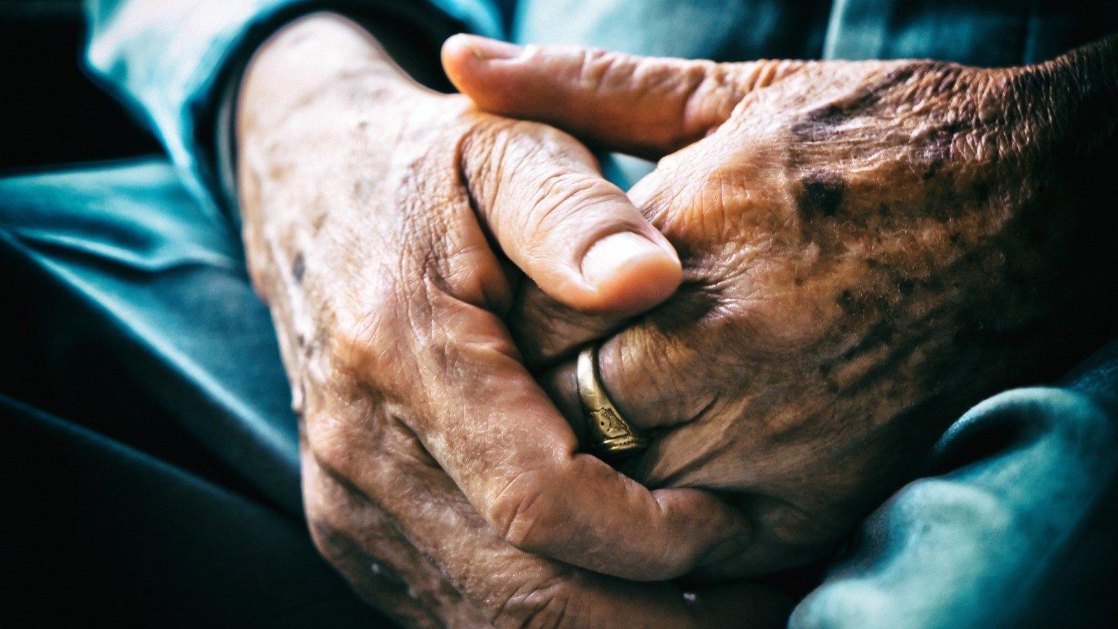 Two people holding hands