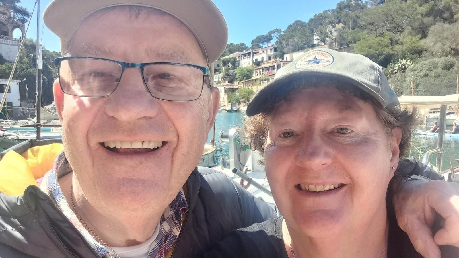 Alan and Karen Johnson on holiday. An older couple smiles at the camera