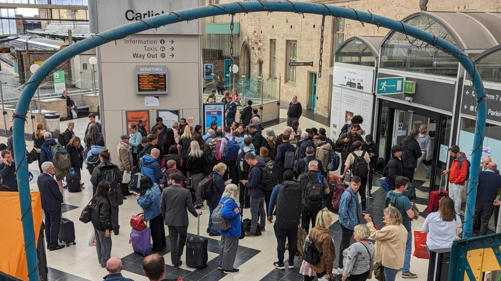 Passengers in the waiting area at Carlisle train station