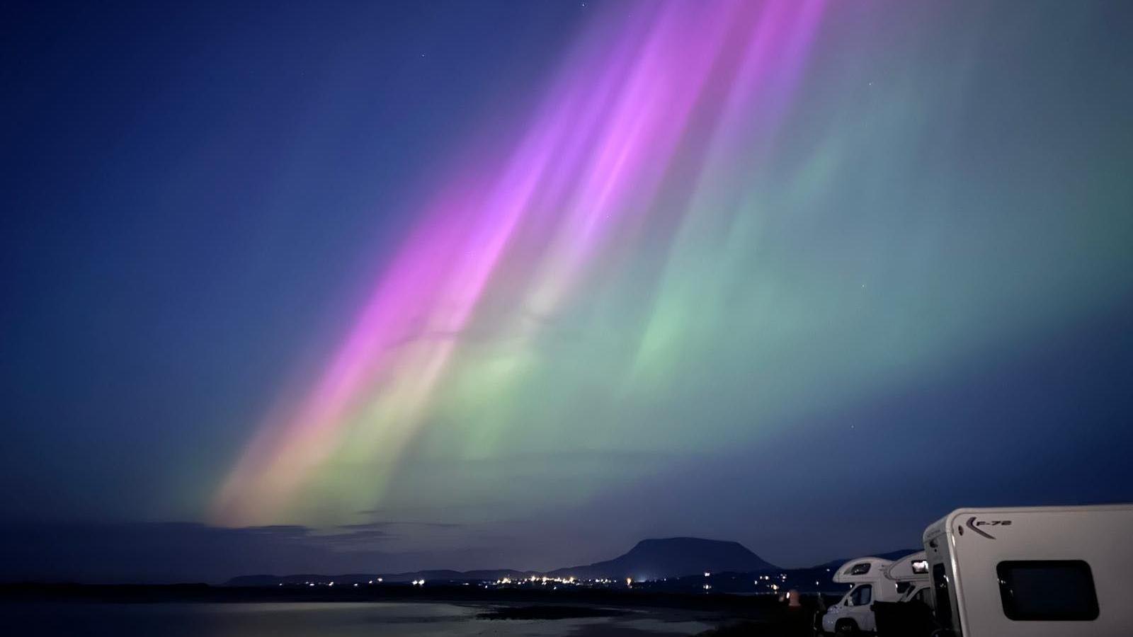 Northern lights over campervans