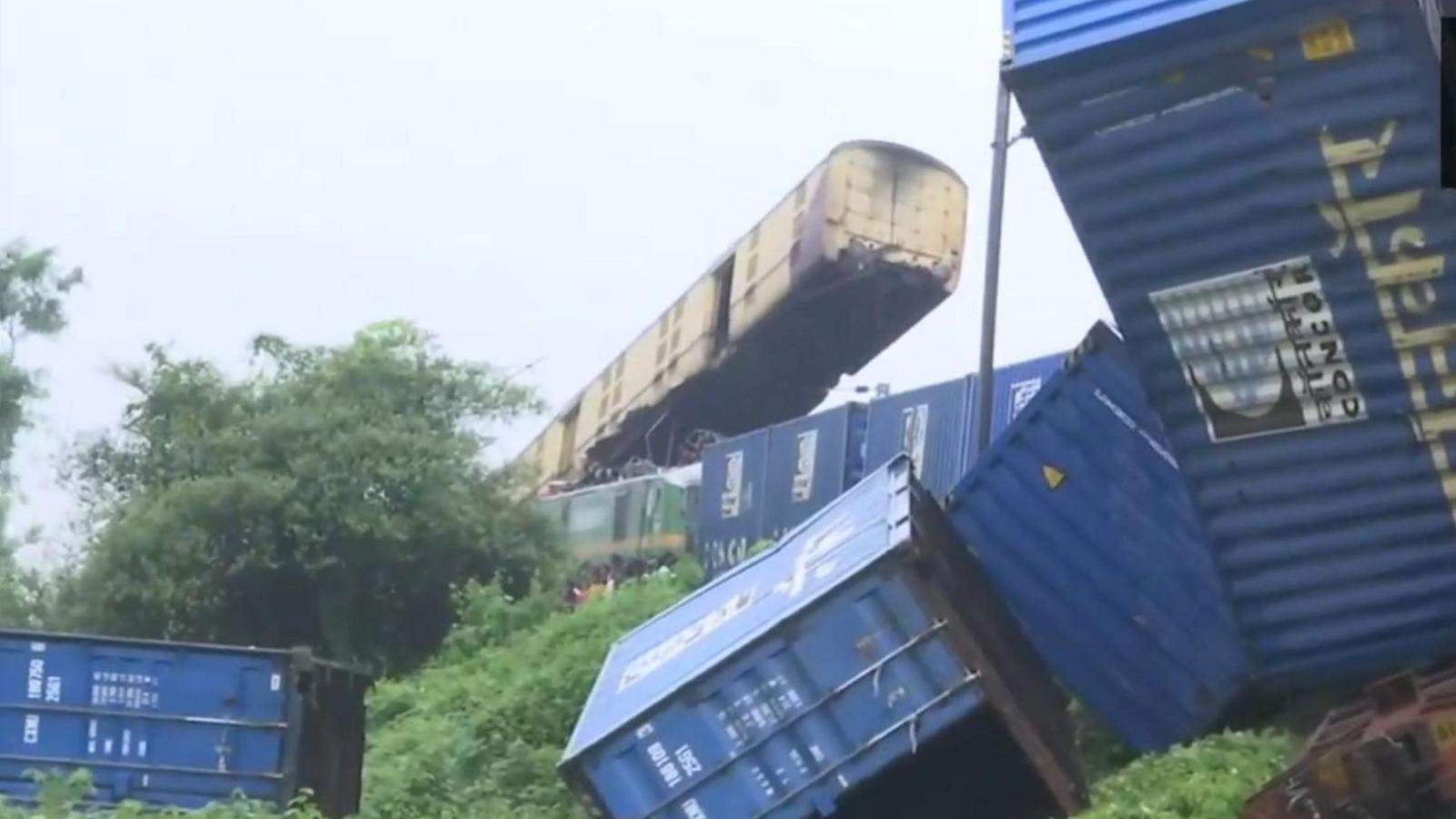 A wagon of the Kanchenjungha Express seen suspended in air after a goods train rammed into it