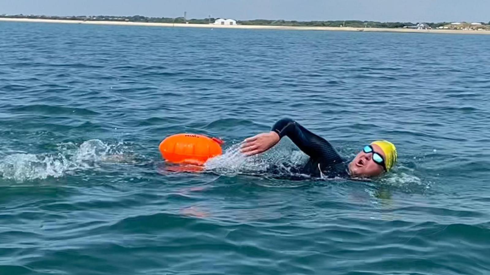 Edwards Sault sea swimming with the Hampshire coast in the distance