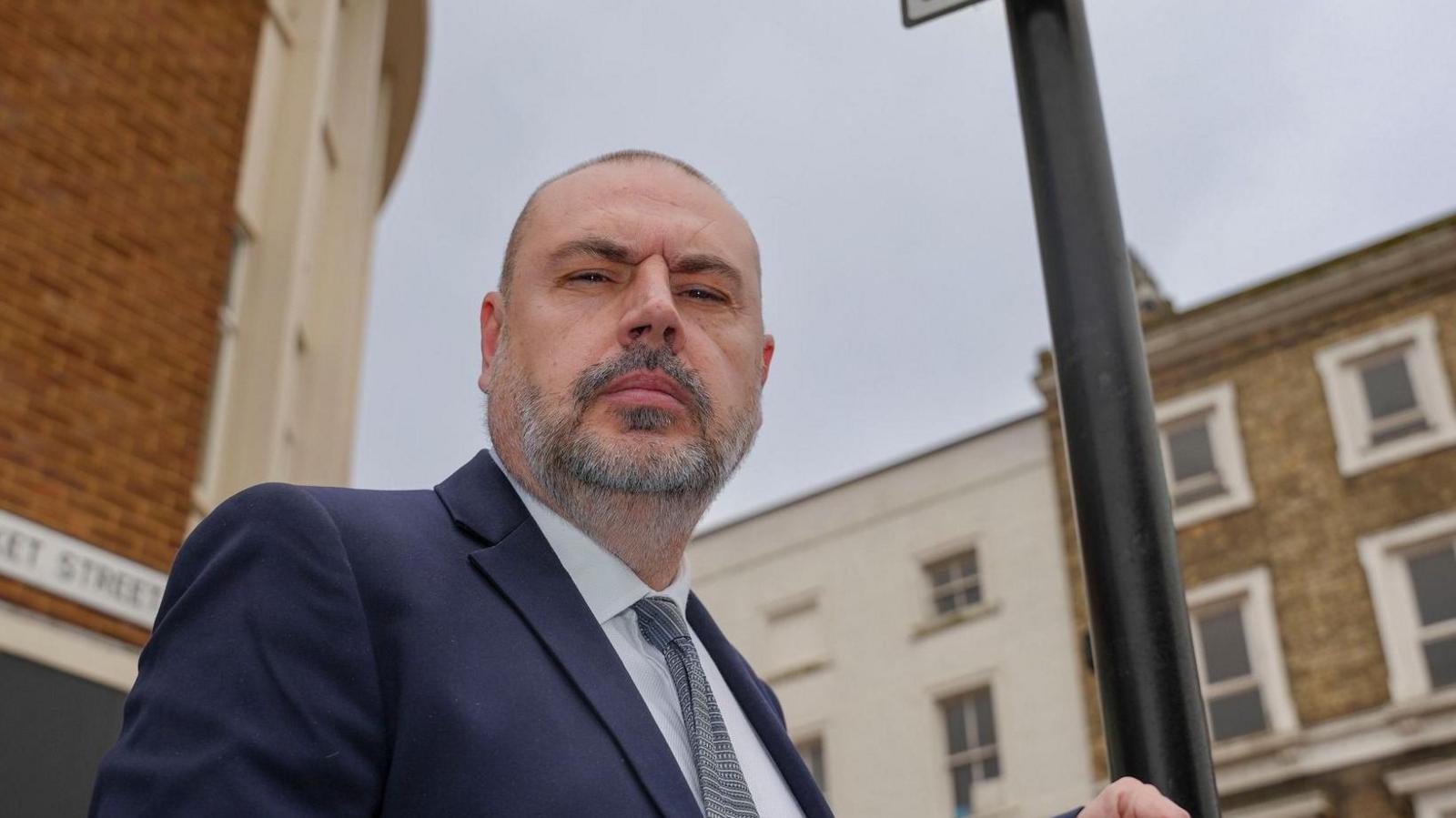 Councillor Craig Collingswood next to a ‘taxis only’ sign at a rank in Wolverhampton