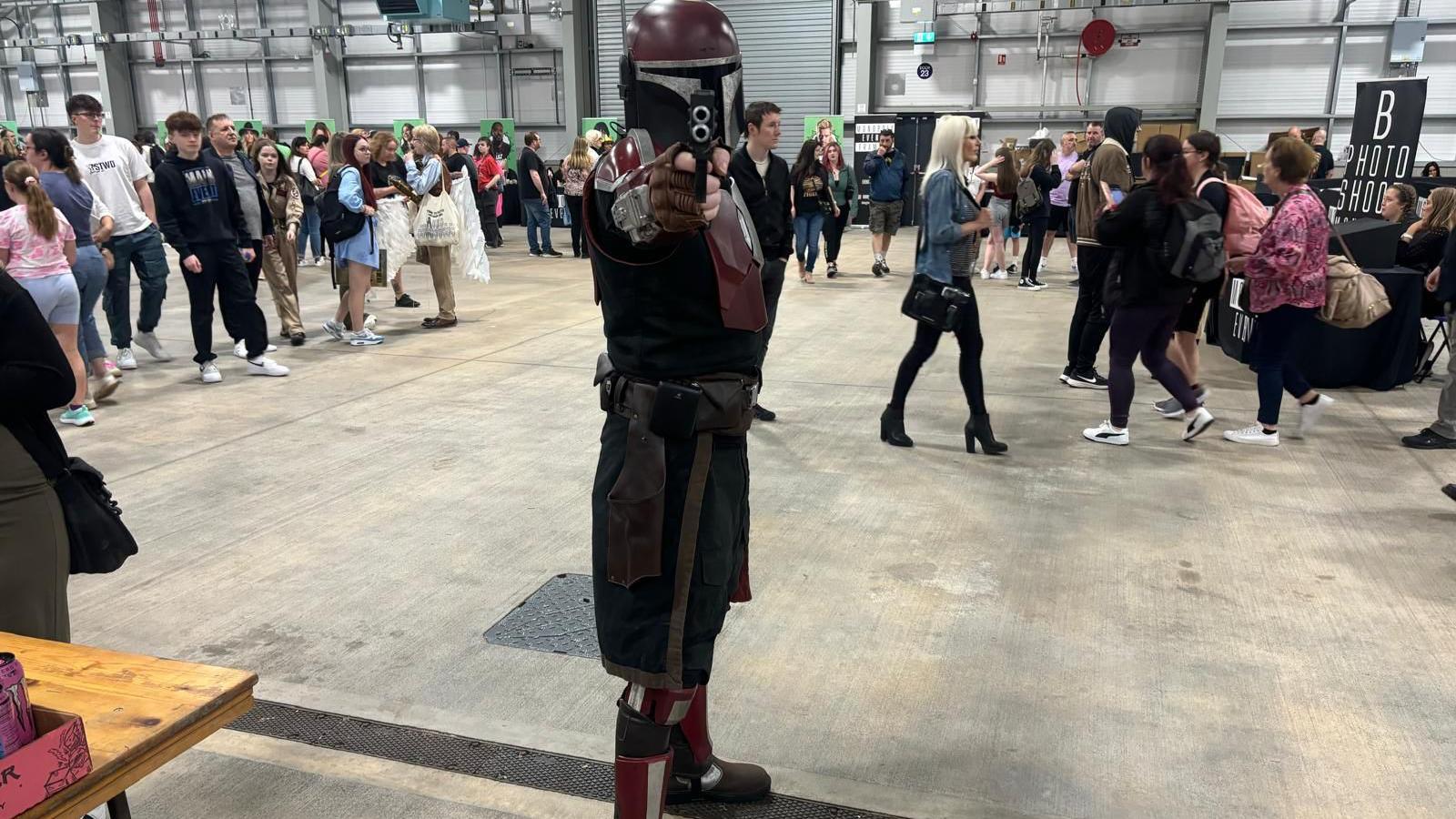 A man dressed as a Mandalorian. 