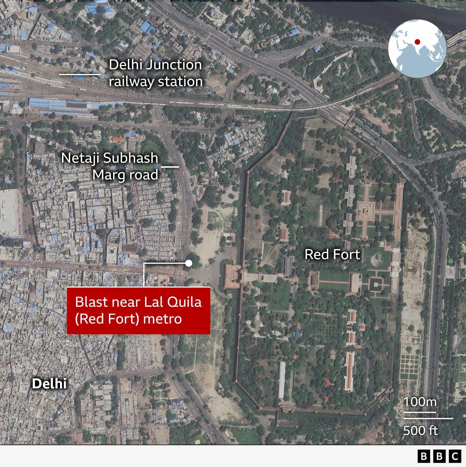 A satellite map of central Delhi showing the location of a blast near Lal Quila (Red Fort) metro station. The Red Fort complex is highlighted on the right, enclosed by walls and green gardens. To the left are densely packed urban areas next to the labeled roads Netaji Subhash Marg. At the top, Delhi Junction railway station is marked.