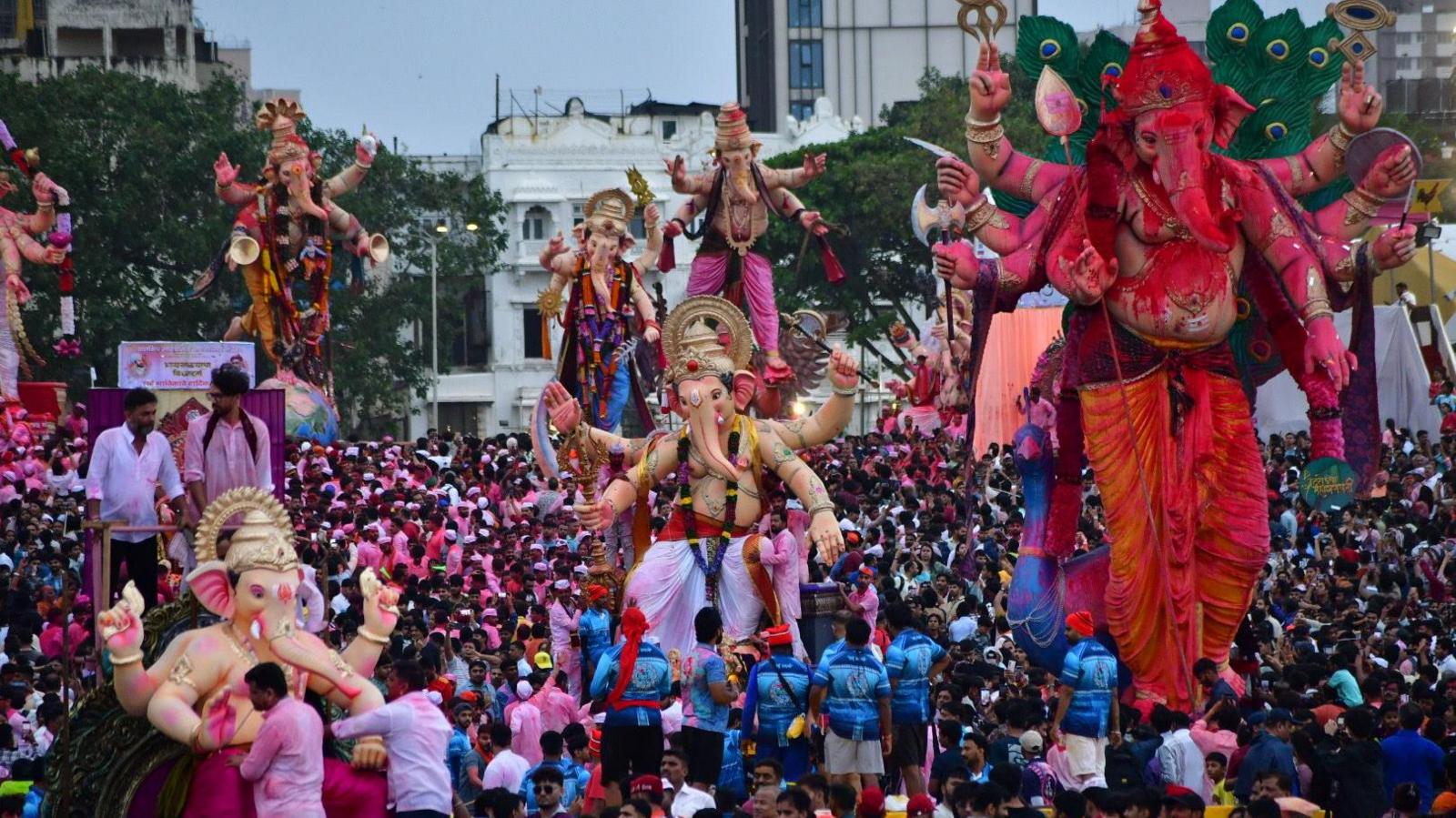 Devotees carry an idol of the Hindu deity Ganesha for immersion at Girgaon Chowpatty during 'Ganesh Chaturthi' festival, on September 6, 2025 in Mumbai, India. 