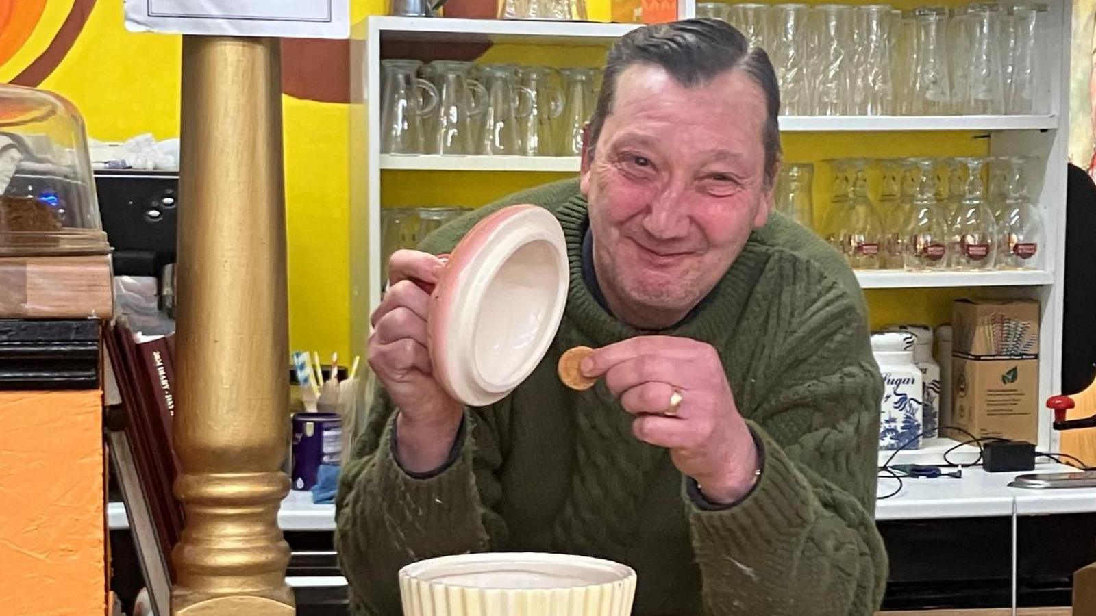 Desmond Baldry at the counter of Desmonds in Lowestoft