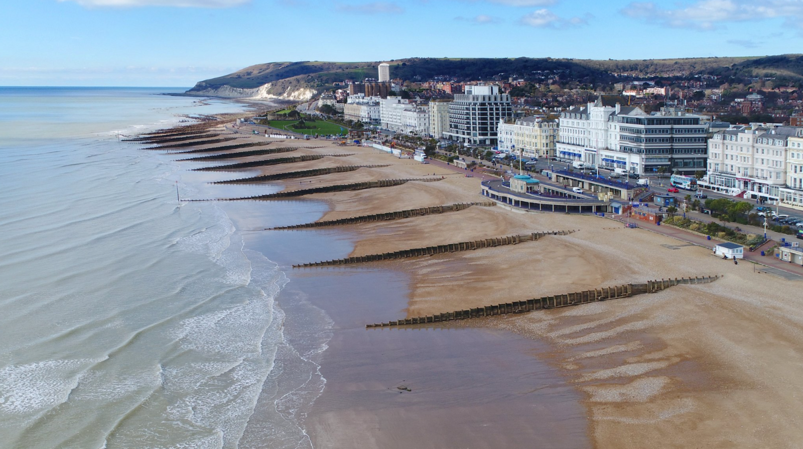 Eastbourne seafront which is lined with hotels and has a long shingle beach with groynes