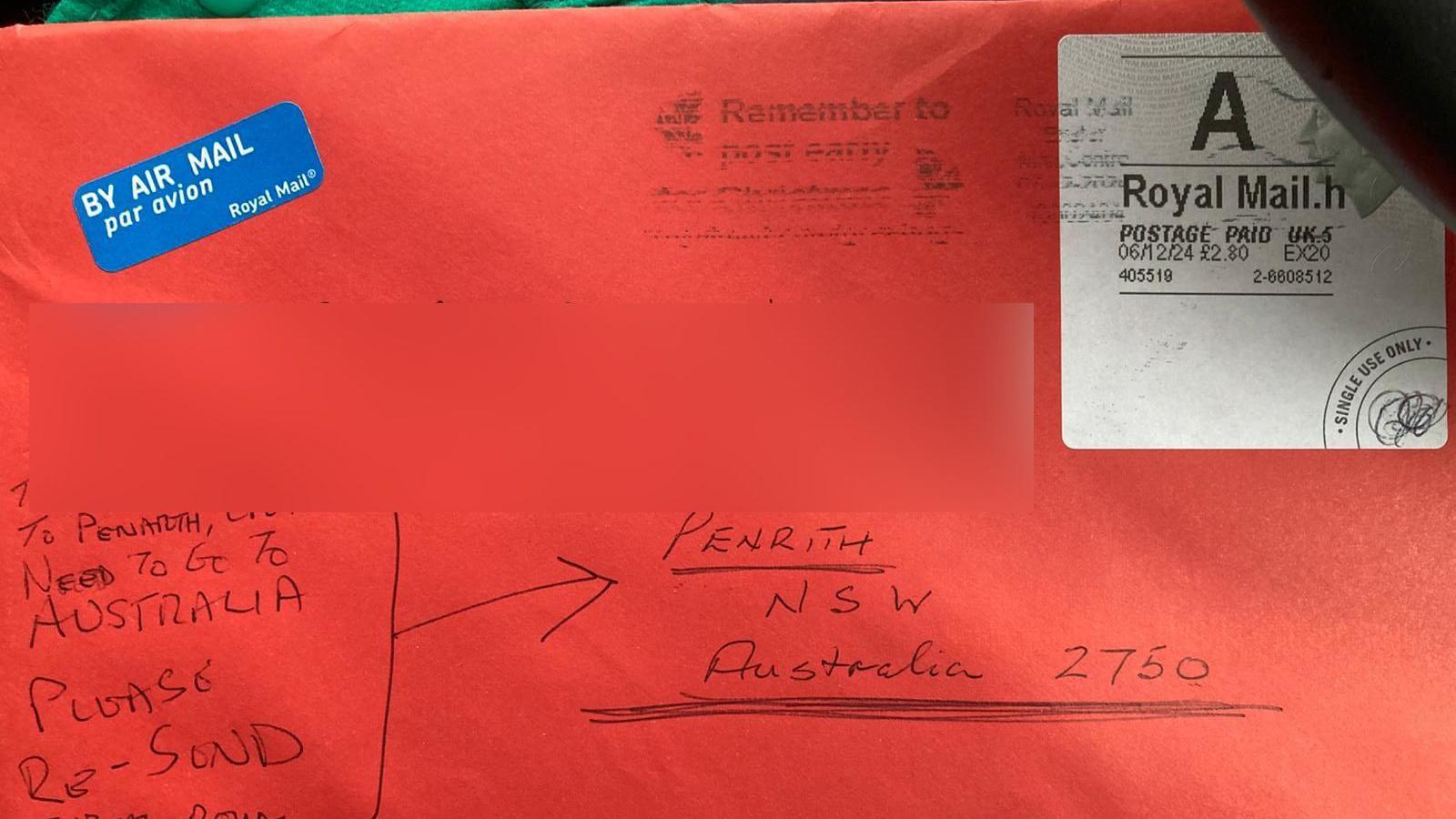 Letter sent mistakenly to Penarth, south Wales rather than Penrith, Australia. It is a red envelope with writing in biro with the air mail sticker and stamp visible in the top left and top right 