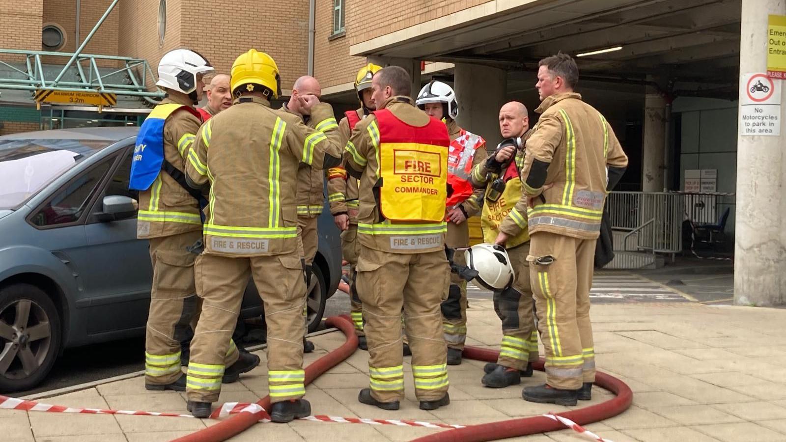 Fire crews standing outside the Bristol Royal Infirmary 