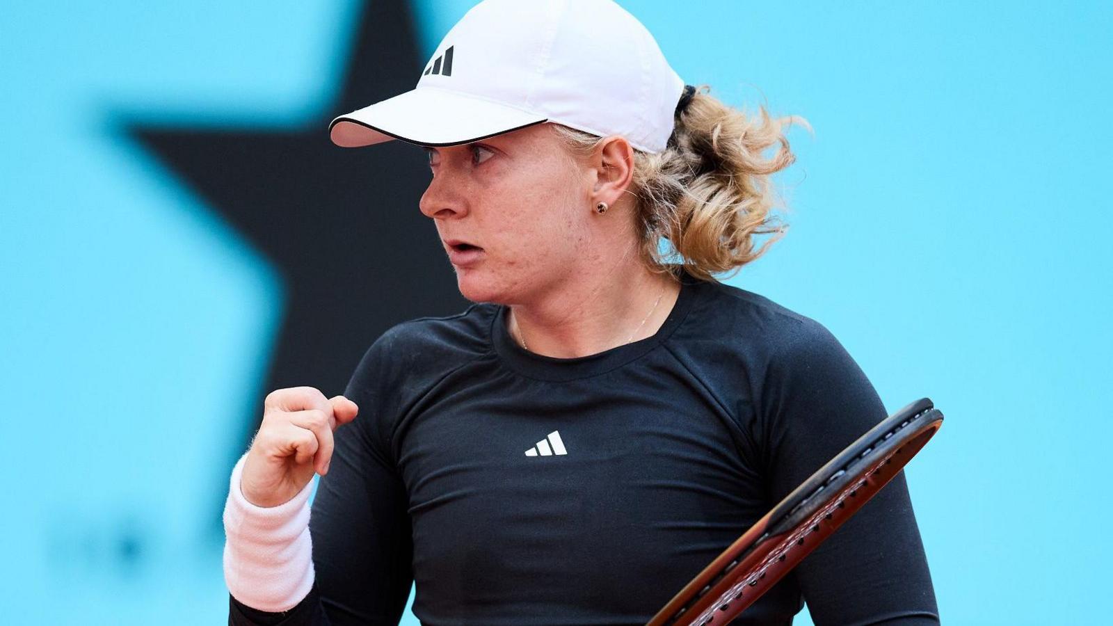 Francesca Jones celebrates winning a point during a match at the Madrid Open