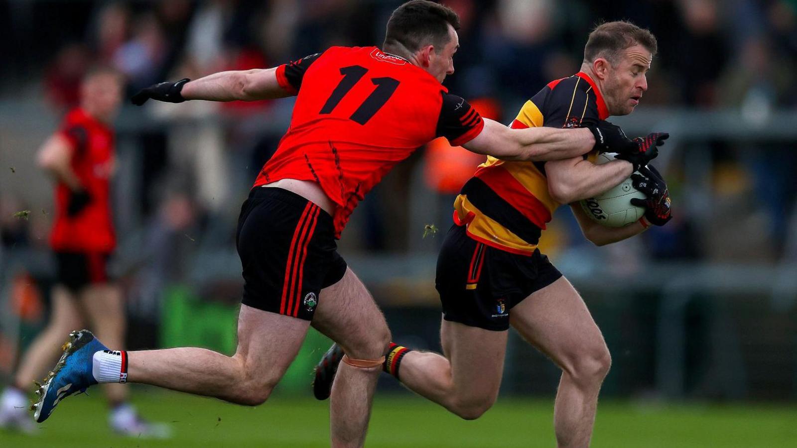 Ciaran Rafferty tackles Michael Murray