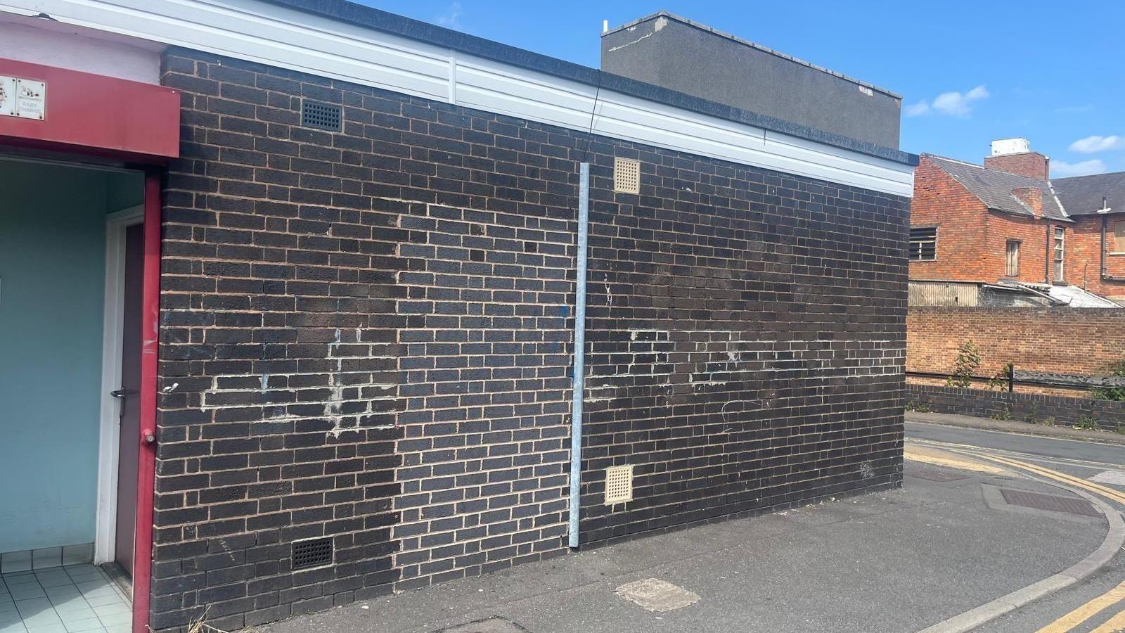 Brown brick square building