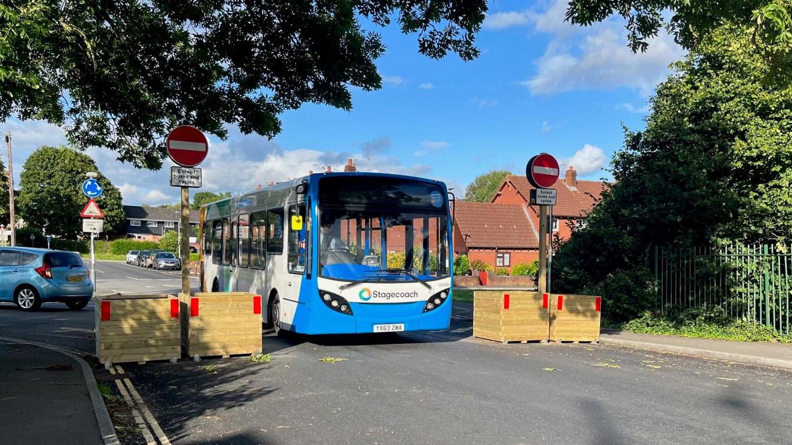 A bus driving along Whipton Lane