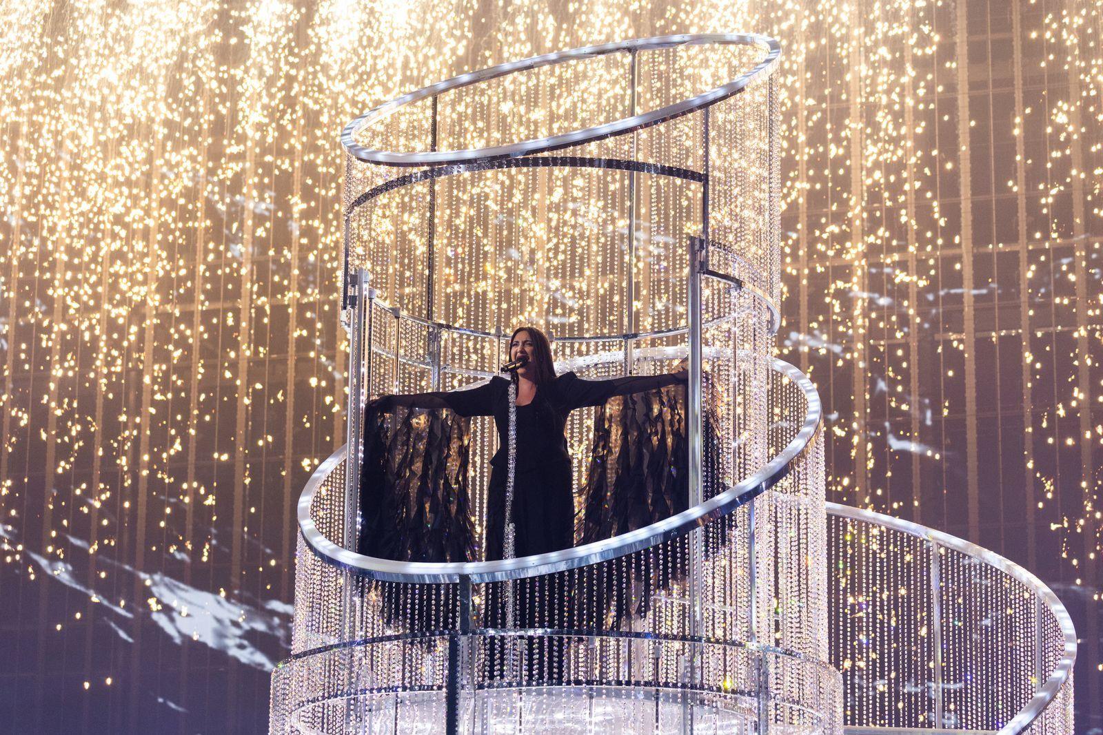 Yuval Raphael sings for Israel with her arms outstretched at the 2025 Eurovision Song Contest