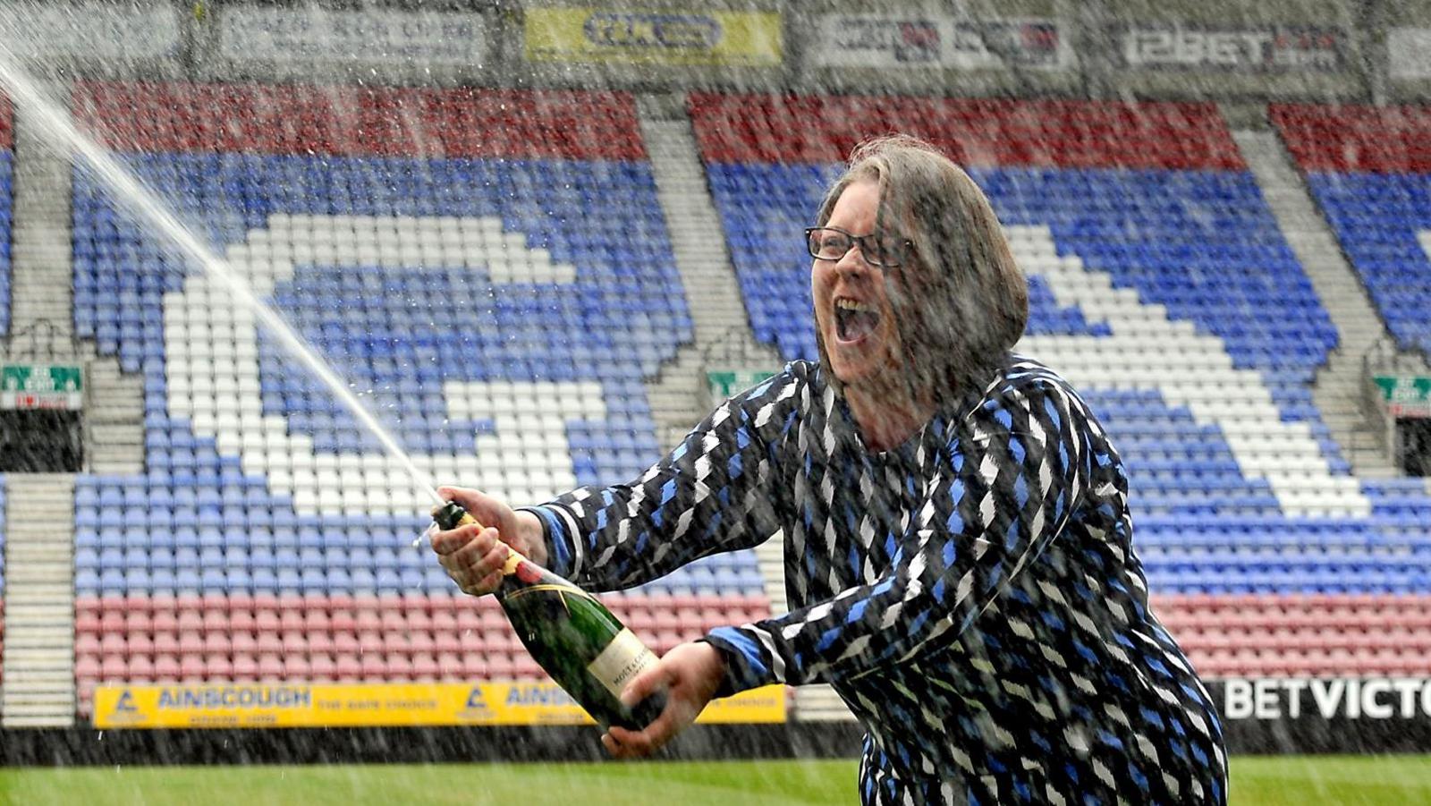 Ms Breen pops a champagne cork